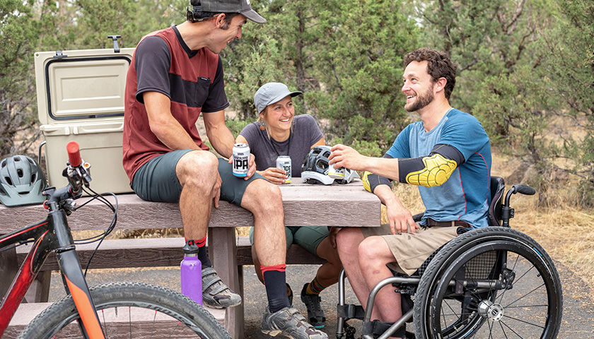 Man-in-Wheel-Chair-with-Friends_840x480